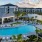 Resort-style swimming pool with lounge seating