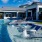 Resort-style swimming pool with lounge seating